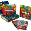 Manifesting Your Greatness by Schiffer Publishing, Ltd. is a colorful oracle deck with illustrated wisdom cards, a vibrant storage box, and a guidebook—featuring artistic designs and motivational phrases for inspiration.