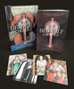 The Beowulf Oracle by Schiffer Publishing, Ltd. is a Viking Age-inspired deck and book set with a dragon-illustrated box, a standing book, and five oracle cards featuring medieval figures.