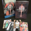 The Beowulf Oracle by Schiffer Publishing, Ltd. is a Viking Age-inspired deck and book set with a dragon-illustrated box, a standing book, and five oracle cards featuring medieval figures.