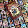 A vibrant Tarot deck with intricate art is spread out, topped by The Zerner/Farber Tarot set from Schiffer Publishing, Ltd., its whimsical guidebook beckoning you to explore your psychic potential.