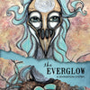Book cover for The Everglow by Schiffer Publishing, Ltd. shows an abstract mask-like face with swirling hair above a bird’s nest of three blue eggs on an earthy background, reflecting the mystique of Tarot and divination systems.