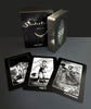 The Nightfall Tarot deck by Schiffer Publishing, Ltd. is shown with its box and three black-and-white cards—Ten of Swords, Page of Swords, and Nine of Pentacles—inspired by Rider-Waite-Smith Tarot imagery.