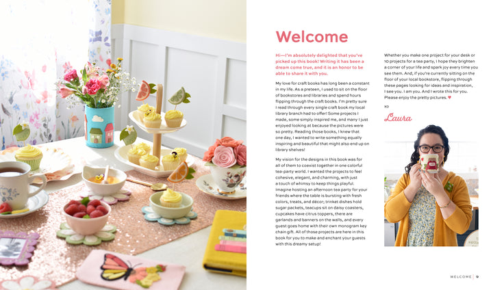 A table with cupcakes and flowers is accented by HeartFELT Crafts to Make and Give from Schiffer Publishing, Ltd., adding a charming touch of handmade decor.