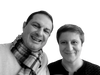 A man in a striped scarf and a woman with short hair smile at the camera against a white background, capturing the playful spirit of 80s design as featured in Schiffer Publishing, Ltd.'s "Iconic Objects of the 1980s.