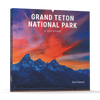 Grand Teton National Park by Schiffer Publishing, Ltd. is a photography book featuring striking images of mountain peaks and sunsets, capturing the breathtaking beauty of Jackson Hole and its surroundings.