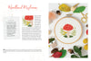 The Sunny Stitches Embroidery Kit Woodland Mushroom by Schiffer Publishing, Ltd. features a stitched red and white mushroom surrounded by grass, small flowers, and autumn leaves—perfect for creating a charming woodland embroidery scene.
