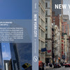 The New York City photo book cover features a bustling Manhattan street scene on the front and One World Trade Center on the back, accompanied by descriptive text about the city.