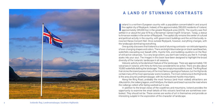 An Icelandic flag from the Iceland book by Schiffer Publishing, Ltd. waves on a flagpole against a cloudy sky above a landscape of dramatic volcanoes.