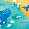Little Hippo, inspired by the Egyptian hippopotamus figurine at the Louvre, hides among white flowers and lily pads under a yellow sky, watching a blue butterfly. Text reads: Hide-and-Seek with Little Hippo by Schiffer Publishing, Ltd.