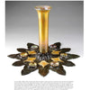 Tiffany Studios' Techniques" by Schiffer Publishing, Ltd. is featured on a white background—a golden iridescent glass vase with a tall neck sits in a bronze base of flower petals, each petal holding a stained glass cup, capturing Art Nouveau elegance.