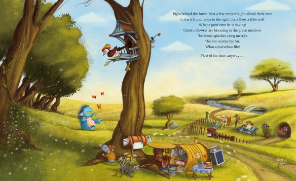 A whimsical meadow scene from "The Grumbletroll" by Schiffer Publishing, Ltd. shows the Grumbletroll and friends sharing adventures in a treehouse, with a cozy house and stream nearby—ideal for children's anger management picture books; text floats in the sky.