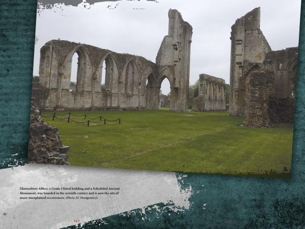 Tall stone arches and walls of Glastonbury Abbey rise from green grass under a moody, overcast sky—an ideal scene for ghost stories explored in "Haunted Britain" from Schiffer Publishing, Ltd.