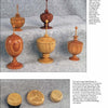 Five polished Turning Boxes with Friction-Fitted Lids from Schiffer Publishing, Ltd. are displayed on a gray surface, including three small round lidded boxes with carved spiral designs—perfect for any woodturning enthusiast.