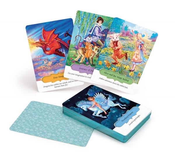 The Inspirational Visions Oracle Cards by Schiffer Publishing, Ltd. showcase vibrant fantasy art—red dragon, fairy tale figures, a flying horse—with descriptive text on each card. In the image, some cards are fanned out; others are stacked face down.