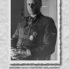 A black and white photo from "Cavalry Divisions of the Waffen-SS" by Schiffer Publishing, Ltd. shows a decorated WWII German officer sitting and looking at the camera, framed by a rough-edged white border.