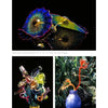 Photograph from "Studio Glass in America" by Schiffer Publishing, Ltd. featuring three vibrant glass sculptures: a blue, yellow, and red ruffled platter; a multicolored abstract vase; and a purple vase with orange-red flower-like stems.