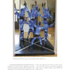 Five mannequins in blue bodysuits pose on a black platform before a mirror, reflecting the artistry and innovation celebrated in Studio Glass in America from Schiffer Publishing, Ltd.