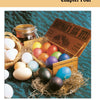 A wooden box labeled "Egg Dyes" holds bright eggs in straw, featuring beeswax designs. Nearby are plain eggs and a jar, all on teal-patterned cloth. Caption: Chapter Four. Product: Decorating Eggs by Schiffer Publishing, Ltd.