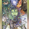 A card from The Stone Circle Oracle by Schiffer Publishing, Ltd. depicts The Green Man—a leafy green-faced figure among animals, birds, lush foliage, and a glowing full moon.