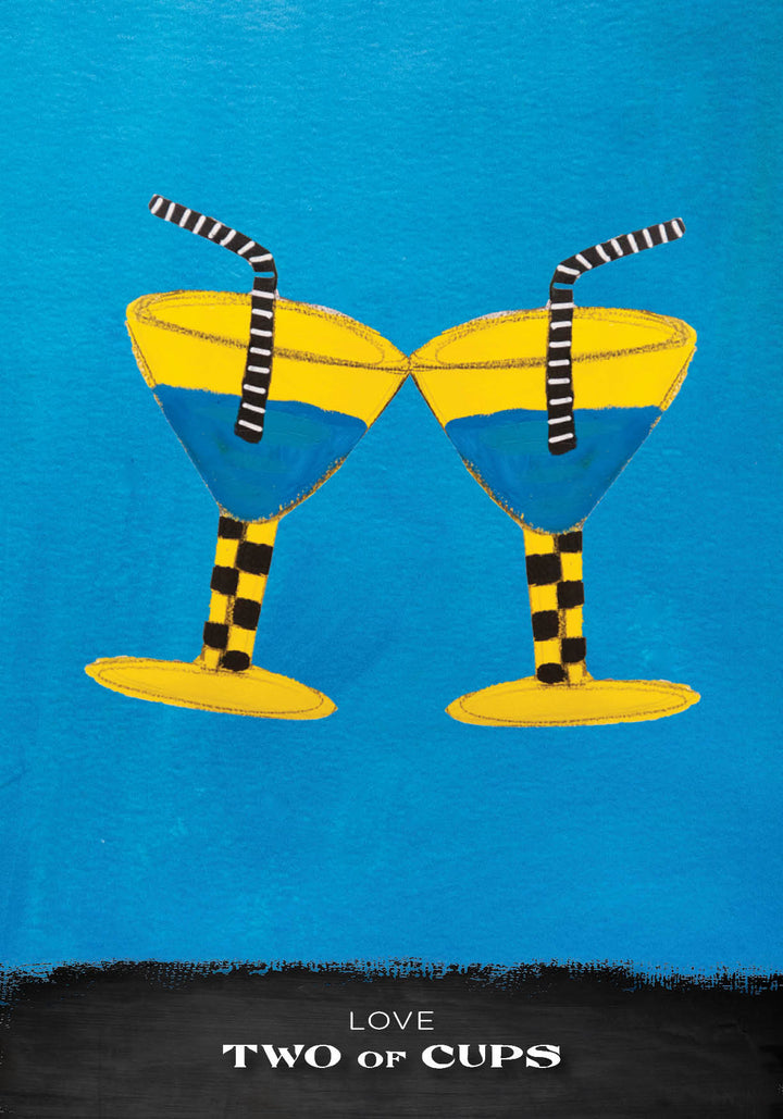 Two yellow cocktail glasses with blue liquid and striped straws clink on a blue background. Their checkered stems echo the bold style of the Outsider Art Tarot by Schiffer Publishing, Ltd. Text below: LOVE TWO OF CUPS.