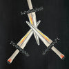 A drawing of several swords from the Outsider Art Tarot by Schiffer Publishing, Ltd., featuring raw lines and an unconventional style.