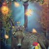 A gentle fawn with a flower crown rests by a red and yellow bird, aglow with fireflies in a lantern-lit forest. Text: Hummingbird Wisdom Oracle Cards by Schiffer Publishing, Ltd.—with affirmations for kindness and growth.