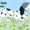An illustrated spotted dog with a blue collar sniffs a yellow flower in a grassy field, while a cat watches. From Finley Feels by Schiffer Publishing, Ltd.—a children’s board book about emotions. Text reads, "Finley feels curious.
